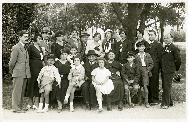 Family Photo – Rivka and Refael Majer surrounded by members of their family, Belgrade, 1935.  Nineteen of the individuals in the photograph were murdered in the Holocaust.